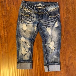 Almost famous low rise distressed Jean capris. Size 1.